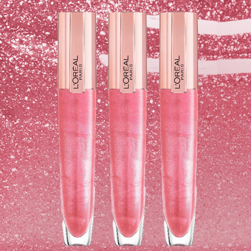 Three L'Oréal Paris liquid lip gloss tubes in a shimmering pink shade, arranged vertically against a sparkling pink background. 3x LOreal Paris Glow Paradise Plumping Lip Gloss 406 i Amplify