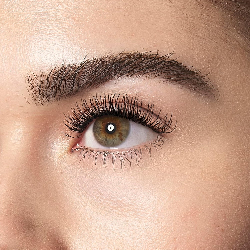 Close-up of a person's eye with detailed eyelashes and eyebrow