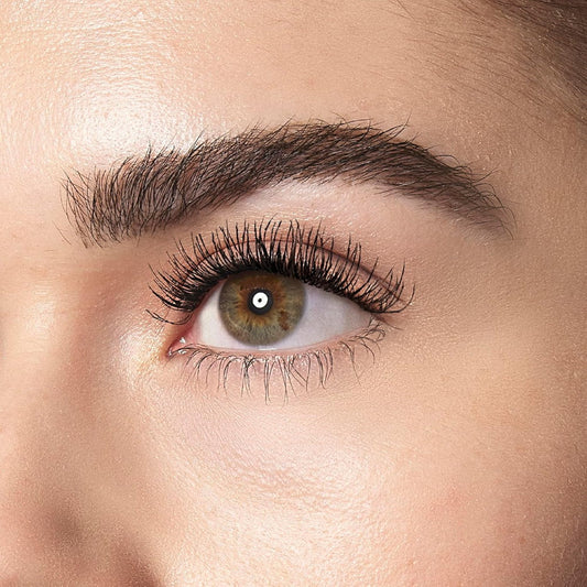Close-up of a person's eye with detailed eyelashes and eyebrow