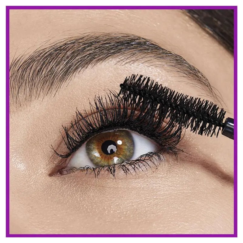 Close-up of an eye with mascara being applied, with a purple border.
