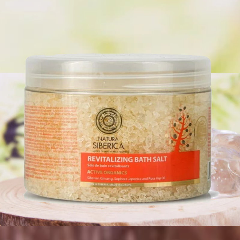 Natura Siberica revitalizing bath salt container on a blurred natural background